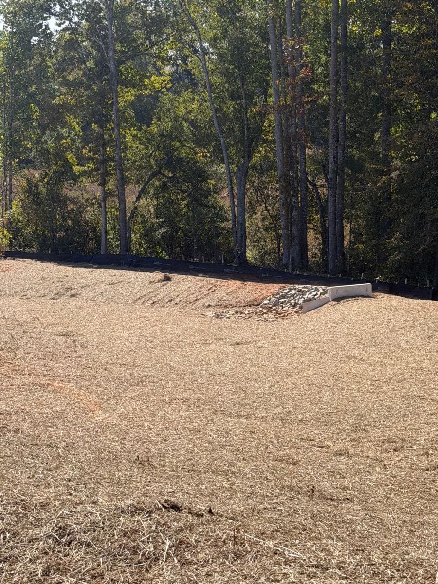 Strawed bank above a pipe outlet